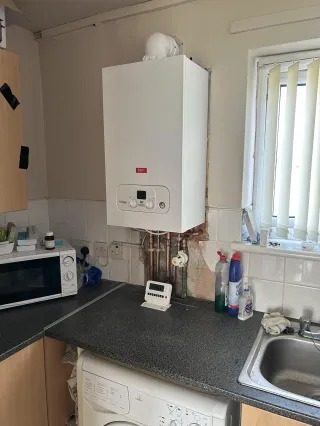Combi boiler installation in a Liverpool kitchen with new pipework