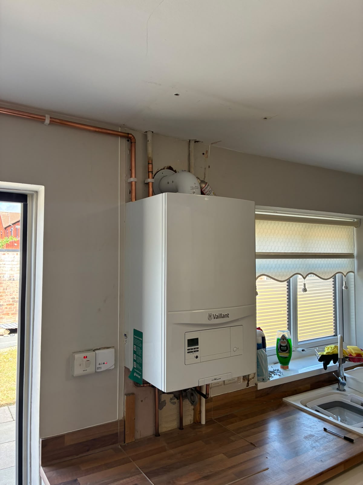 Vaillant combi boiler installed in a Liverpool kitchen with new copper pipework