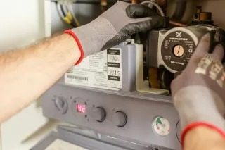 Gas Safe registered engineer carrying out a gas appliance repair in Liverpool
