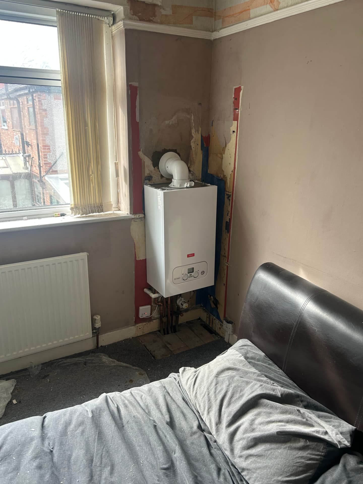 Main combi boiler installed in a bedroom corner, Liverpool